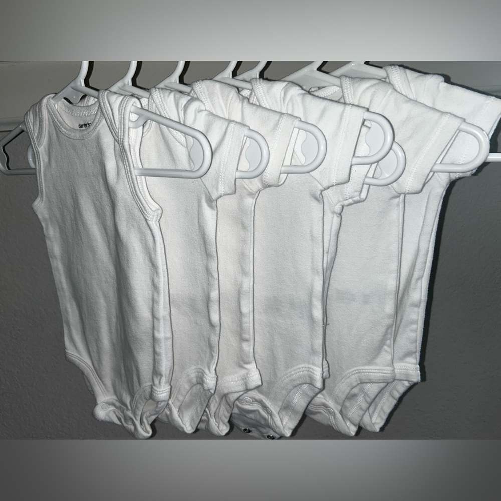 7 White Carter’s Onesies